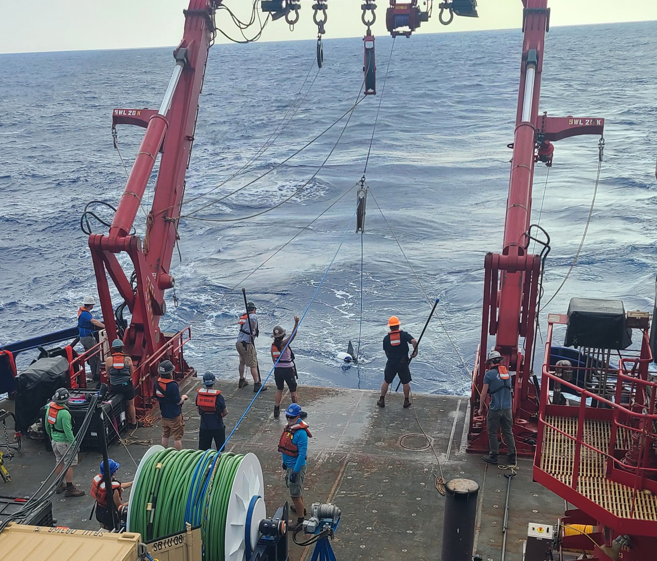 Recovering a GPS tail buoy from the back deck of R/V Sikuliaq